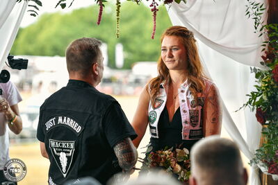 Guests and crowd gathered for a wedding ceremony on the mainstage at Wacken Open Air 2026.